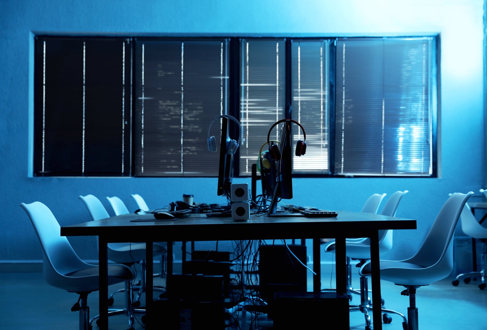 Data infrastructure in a blue-lit operations room
