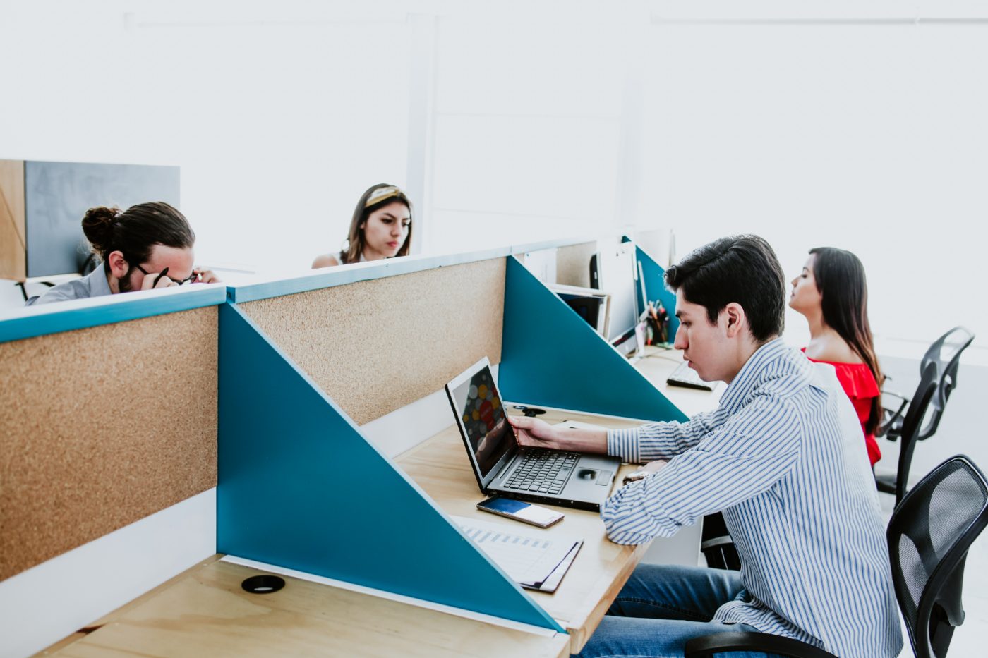Person working on a laptop in an office