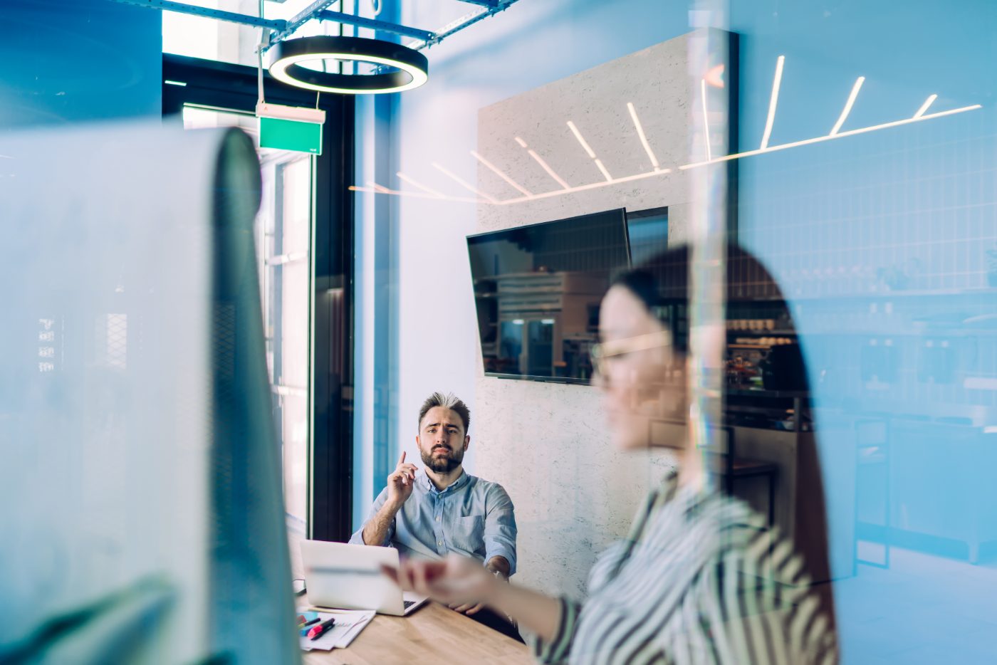 Two colleagues collaborating in a modern office