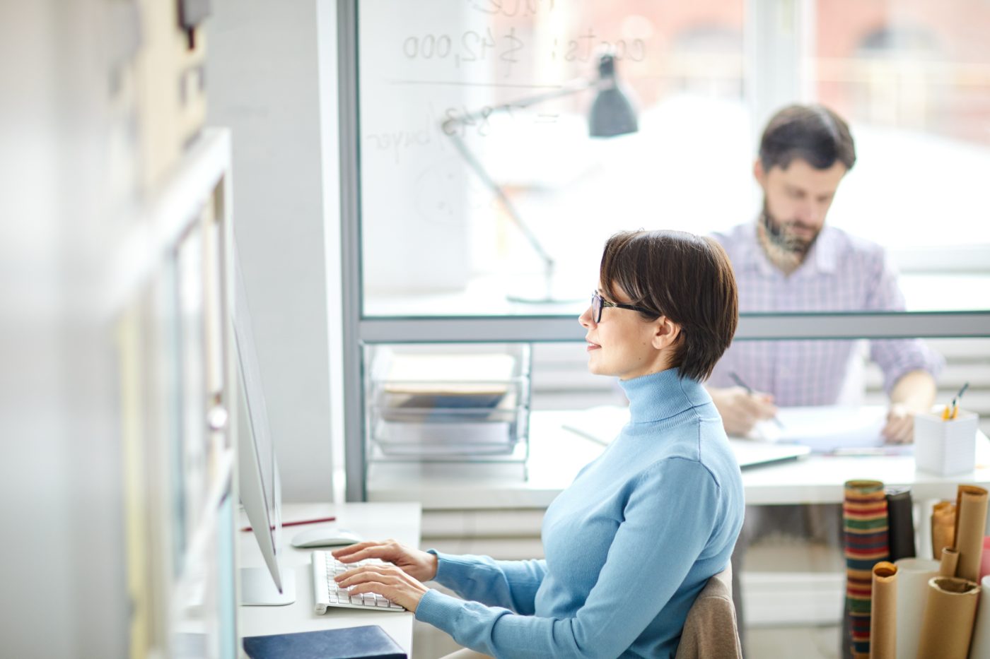 Woman working at a desk in an open office